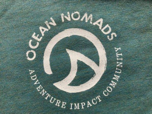 Ocean Nomads Hoodies - Ladies logo on a ladies' green hoodie.