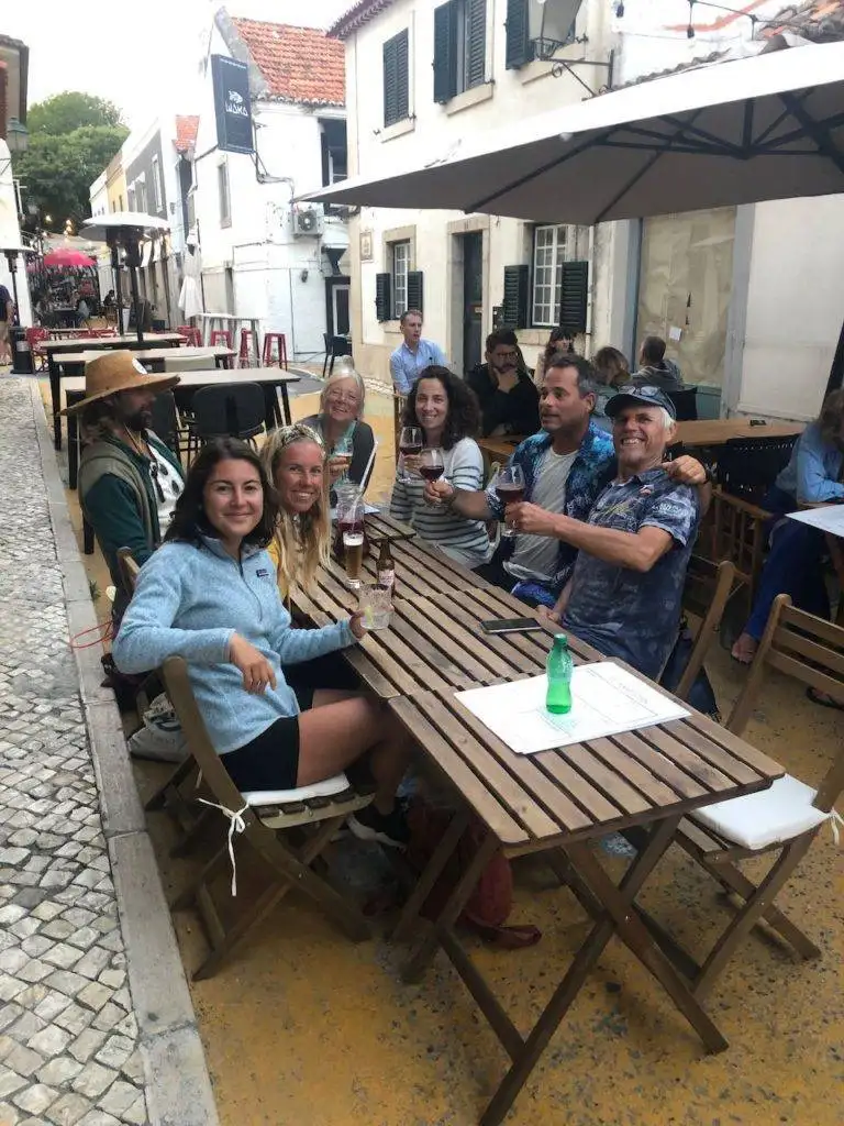 a group of people sitting at a table.