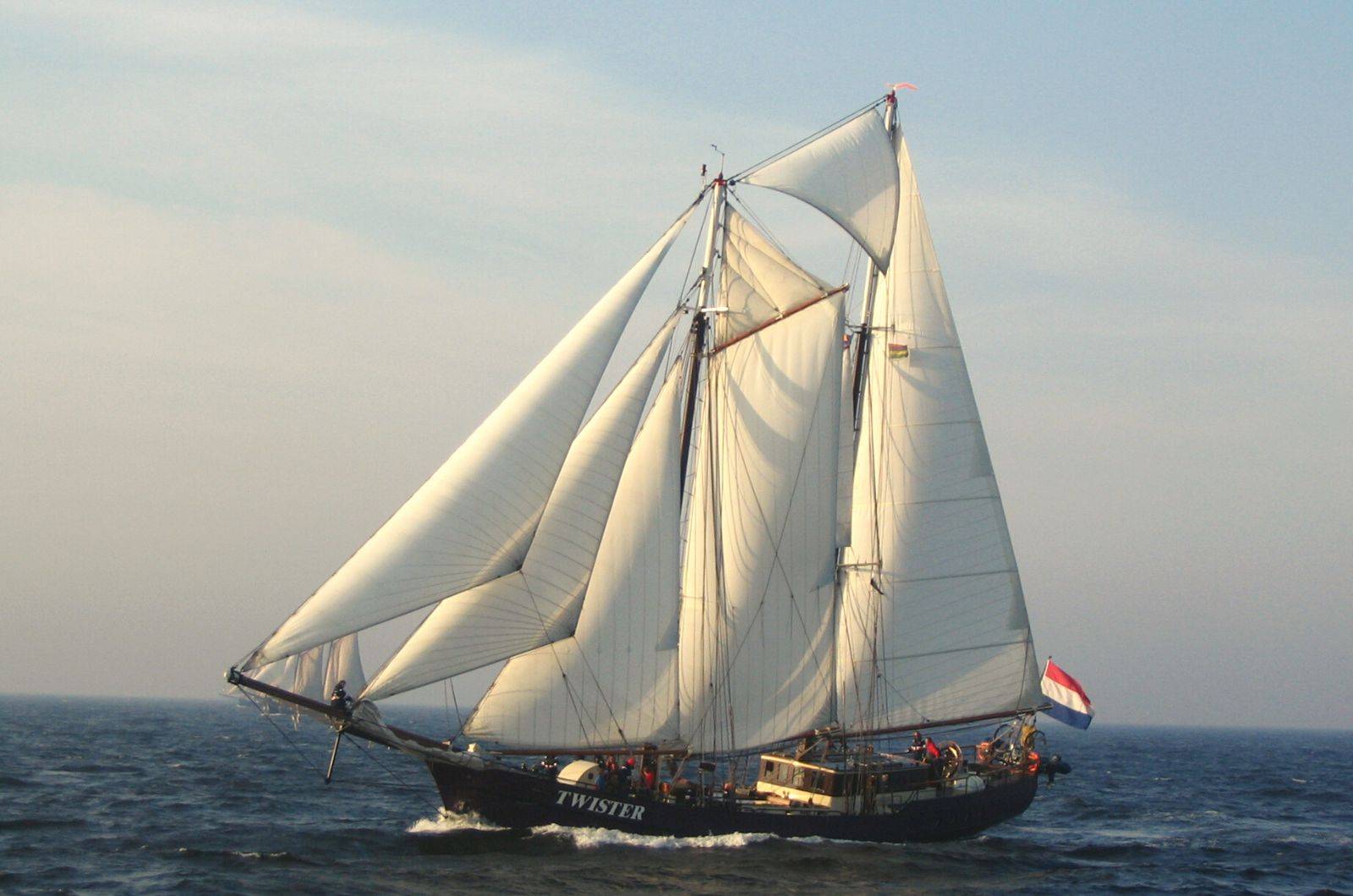 a sail boat in the ocean.