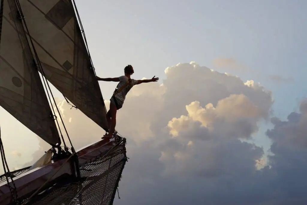 A person on a sailboat.