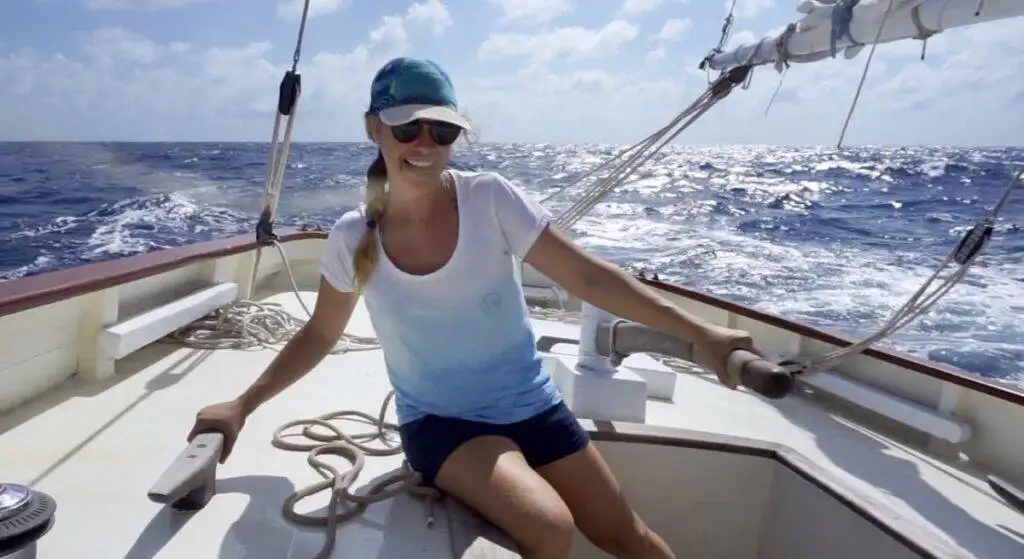 A woman traveling by sail on a boat.