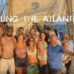 A sailing crew on a boat, journeying across the Atlantic.